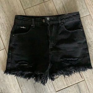 Black distressed jean shorts.